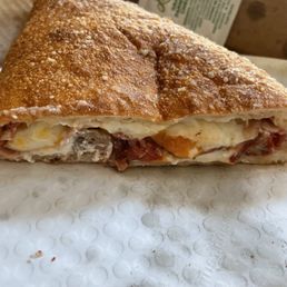 Ham, bacon, cheddar, meatball large Calzone $18 Ham, bacon, cheddar, meatball large Calzone $18