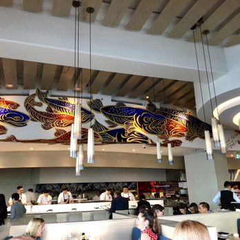 Miku - Indoor dining area with sushi chefs hard at work. - Japanese Near Me - Vancouver, British Columbia