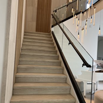 Madeira Flooring - a staircase leading to a living room - Flooring Near Me Madeira Flooring - a staircase leading to a living room - Flooring Near Me