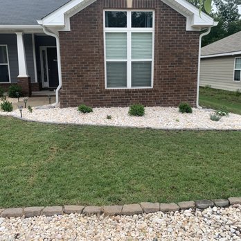 Labra Landscaping - the front yard of a house with a lawn and landscaping - Lawn Services Near Me