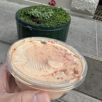 Murray's Bagels - A half a pound of cream cheese in a third empty half pound container - Bagels Near Me - New York, New York