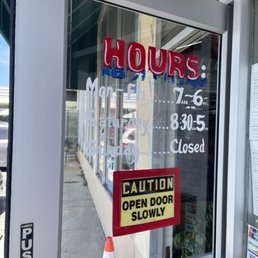 Exterior outside entrance of One Hour Dry Cleaning - Store hours posted as of April 2022. - San Bruno, California Exterior outside entrance of One Hour Dry Cleaning - Store hours posted as of April 2022. - San Bruno, California