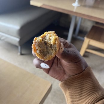Bucky Moonshine's - a hand holding a muffin - Cajun/Creole Near Me - Dallas, Texas Bucky Moonshine's - a hand holding a muffin - Cajun/Creole Near Me - Dallas, Texas