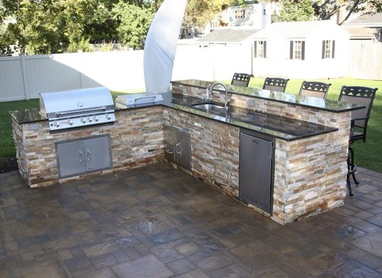 Custom California Kitchen - These custom California kitchens were designed and built custom on site. Every detail was selected based on the clients desired look. Custom frame work and finished with beautiful granite counter tops and stone veneer.