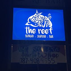 The Reef Fresh Fish & Gourmet Food - Road sign