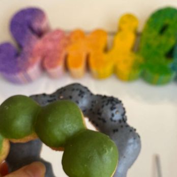 Fat Straws Boba & Mochi Donuts - a hand holding a doughnut - Bubble Tea Near Me - Dallas, Texas
