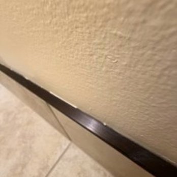 Flooring America Fairfax - No caulk in the wall to schluter gap. - Flooring Near Me - Fairfax, Virginia Flooring America Fairfax - No caulk in the wall to schluter gap. - Flooring Near Me - Fairfax, Virginia
