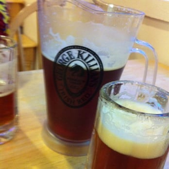 Yummy Pizza - a pitcher of beer and a glass of beer - Pizza Near Me - Granger, Indiana
