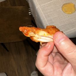 Asian zing traditional wing with a hair cooked into it pretty sickening. Asian zing traditional wing with a hair cooked into it pretty sickening.