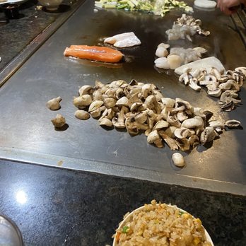 Japanese Kitchen - Mushrooms, salmon, vegetables, and fish on the flattop - Sushi Bars Near Me - Clovis, California