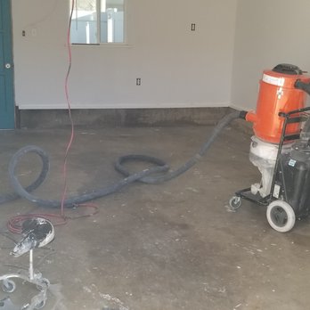 Viscous Epoxy Floors - a concrete floor being cleaned - Flooring Near Me