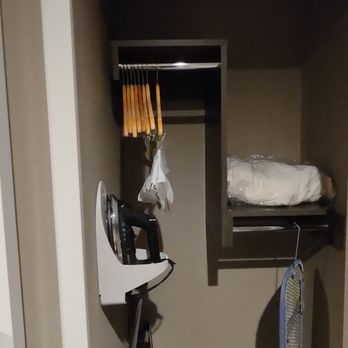 Hampton Inn & Suites Adrian - The closet has an iron, luggage rack, many wooden removable hangers, short ironing board, an extra blanket and laundry service bag. - Hotels Near Me - Adrian, Michigan