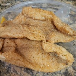 Poorly cooked fried catfish that probably would have made me sick if I had consumed it. A waste of funds.