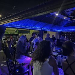 100 Proof Bar and Bites - Outdoor covered bar and patio , tables with umbrellas and live music !!