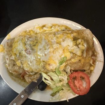 Toledo's Mexican Restaurant - Chili Verde burrito with chili Verde on top - Mexican Near Me - Fresno, California Toledo's Mexican Restaurant - Chili Verde burrito with chili Verde on top - Mexican Near Me - Fresno, California