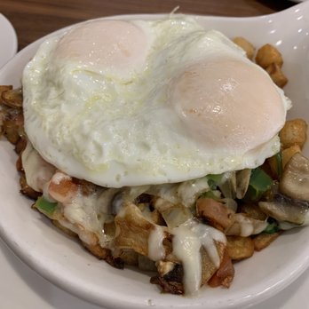 Brunch Cafe-Niles - Vegetable skillet with fried eggs on top - LOADED with vegetables, so good! - Breakfast & Brunch Near Me - Niles, Illinois