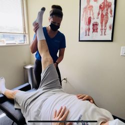 MVP Chiropractic - Dr. Shelby Preston doing Neuromuscular Rehabilitation on patient at MVP Chiropractic and Physical Therapy in New Lenox