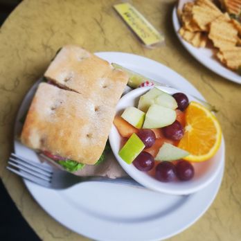 College Grounds Cafe - A club sandwich on a Sourdough bread with fruits - Cafes Near Me - Columbia, South Carolina