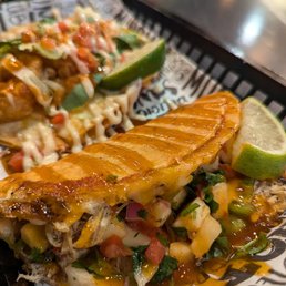 Jerk Chicken. Grilled chicken topped with fresh pineapple pico and sweet & spicy habanero sauce.