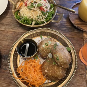 Sisters Thai - chive dumpling & som tum (green papaya salad). - Thai Near Me - Potomac, Maryland Sisters Thai - chive dumpling & som tum (green papaya salad). - Thai Near Me - Potomac, Maryland