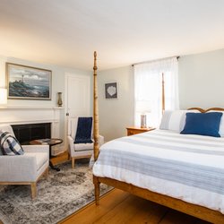 Spouter Inn Bed and Breakfast - Harbormaster Quarters offers a spacious room with ocean views and a queen size bed, in addition to a spacious bathroom with Jacuzzi tub.