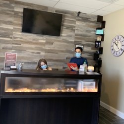 K Chiropractic - Dr. K and Chelsea at our front desk