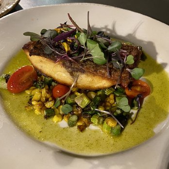 Bluewater Grill Seafood Restaurant & Market Carlsbad - Roasted Striped Bass, Local Pan roasted crispy skin striped bass, corn, asparagus, grape tomato and lemon thyme oil - Seafood Near Me - Carlsbad, California