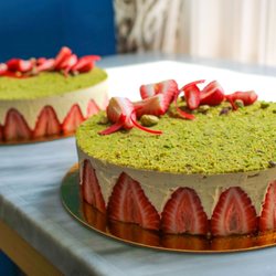 Harrison's Fine Pastries - Pistachio fraisier featuring fresh strawberries, Tahitian vanilla bean, and pistachio sponge cake