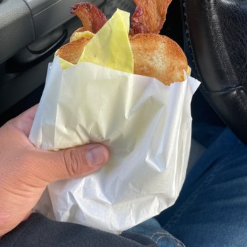 Dippity Donuts - a person holding a sandwich in a paper bag - Donuts Near Me - Norwalk, California Dippity Donuts - a person holding a sandwich in a paper bag - Donuts Near Me - Norwalk, California