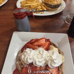 Fruit waffle and cheeseburger with fries Fruit waffle and cheeseburger with fries