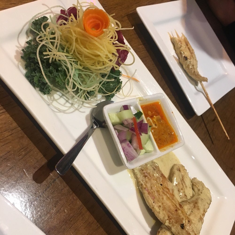 Thai Princess - Coconut Chicken satay with peanut sauce, sweet relish and decorative crudite - Thai Near Me - Okemos, Michigan Thai Princess - Coconut Chicken satay with peanut sauce, sweet relish and decorative crudite - Thai Near Me - Okemos, Michigan