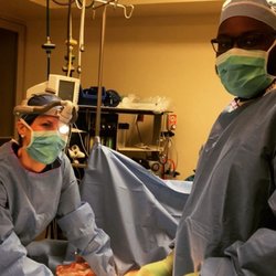Heights Plastic Surgery - Dr. Cara Downey busy moments in the OR.
