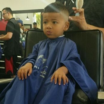 Hair Mechanikz - My son recently getting a hair cut with a mouth full of candy from the little quarter machine there. - Barbers Near Me - Oxnard, California Hair Mechanikz - My son recently getting a hair cut with a mouth full of candy from the little quarter machine there. - Barbers Near Me - Oxnard, California