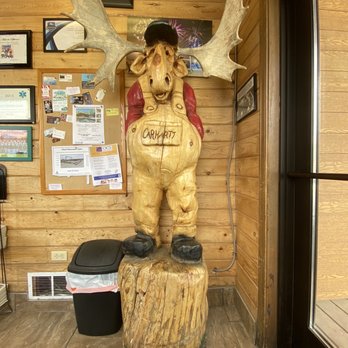 Noisy Goose Cafe - a wooden moose with a hat and overalls - American Near Me - Palmer, Alaska Noisy Goose Cafe - a wooden moose with a hat and overalls - American Near Me - Palmer, Alaska