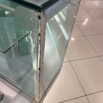 Macy's - Broken glass that could easily cut a kid or person who leans on it - Department Stores Near Me - San Jose, California