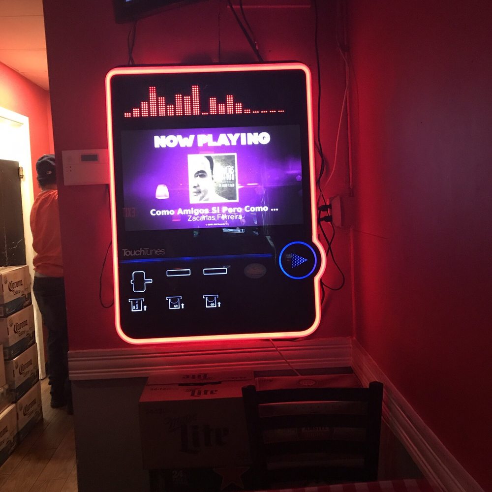 Barrilito - a television mounted on a wall - Bars Near Me - Washington, DC, District of Columbia
