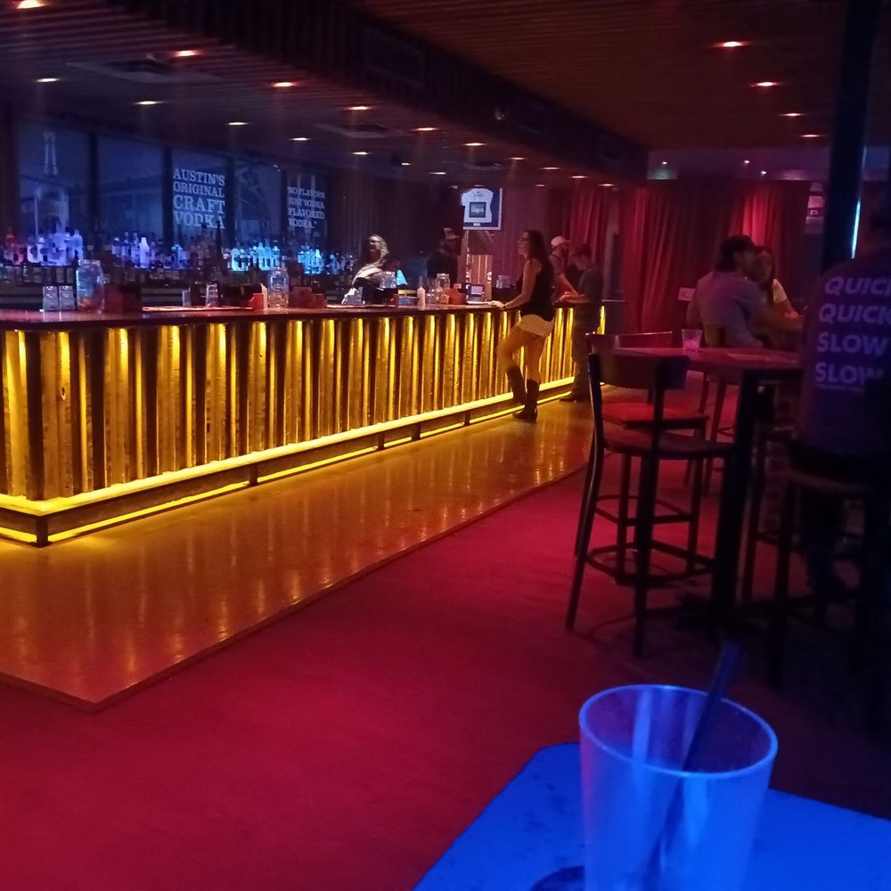 a bar with neon lights a bar with neon lights