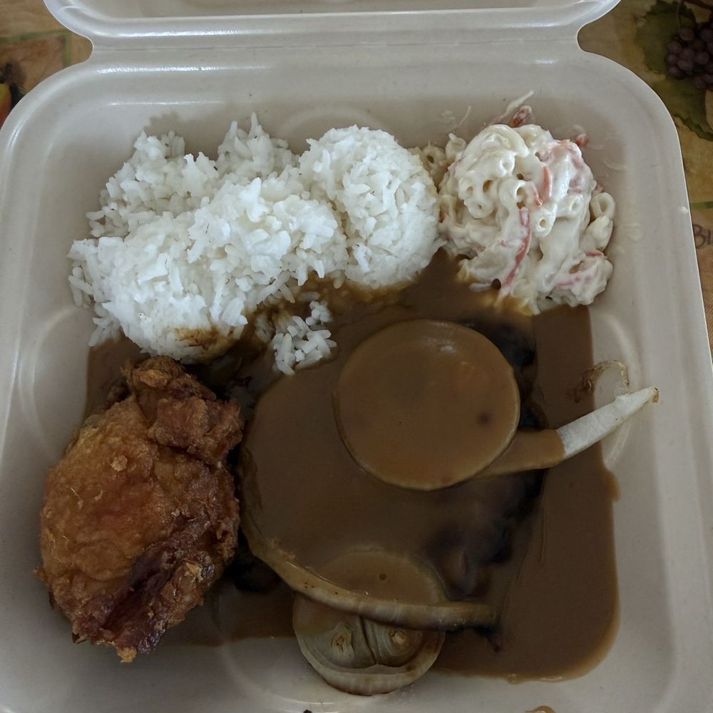Hamburger Steak plate with an added bonus from owner, a piece of his delicious fried chicken. Hamburger Steak plate with an added bonus from owner, a piece of his delicious fried chicken.