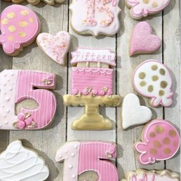 a number of decorated cookies