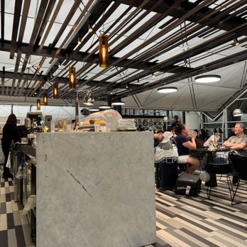 The Centurion Lounge - Dining area and bar - Airport Lounges Near Me - Hong Kong, HK The Centurion Lounge - Dining area and bar - Airport Lounges Near Me - Hong Kong, HK