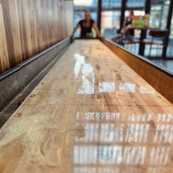 Chicken N Pickle - a wooden shuffle table - Pickleball Near Me - Glendale, Arizona