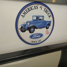 Ford sign in a booth Ford sign in a booth