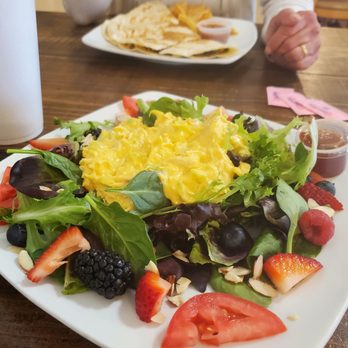Rustika Cafe and Bakery - A different but yummy chicken salad on a bed of spring mix, fruit and tomatoes. - Bakeries Near Me - League City, Texas