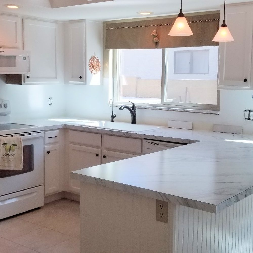 New countertops...no backsplash yet. Looks like marble! New countertops...no backsplash yet. Looks like marble!