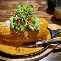 Casa Rios Grill - MASSIVE - A La Crema Skillet Burrito from the new menu. It's got some spice to it. The sauce is addictive.