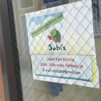 Sabi's Cafe - a sign in a window - Indian Near Me - Fairfield, Iowa