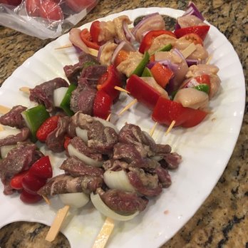 Pollo Tropical - skewers of meat and vegetables on a white plate - Latin American Near Me - Jupiter, Florida Pollo Tropical - skewers of meat and vegetables on a white plate - Latin American Near Me - Jupiter, Florida