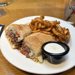 Coolidge Corner Clubhouse - Steak and cheese sandwhich with curly fries