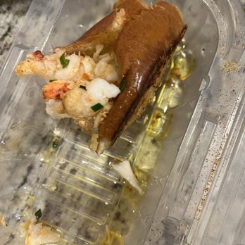 Gretel - Half eaten Lobster Roll.  You better be lucky you even got this picture because I could have easily devoured like 3 more of these. - Cocktail Bars Near Me - Chicago, Illinois
