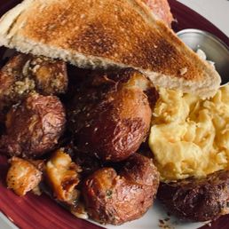 Brunch eggs, toast, potatoes, biscuit